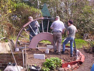 The first half of the tablet is maneuvered into place.